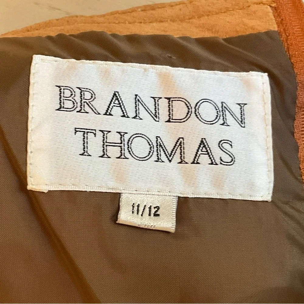 True vintage suede—real leather with clean tailoring an earlier designer era.